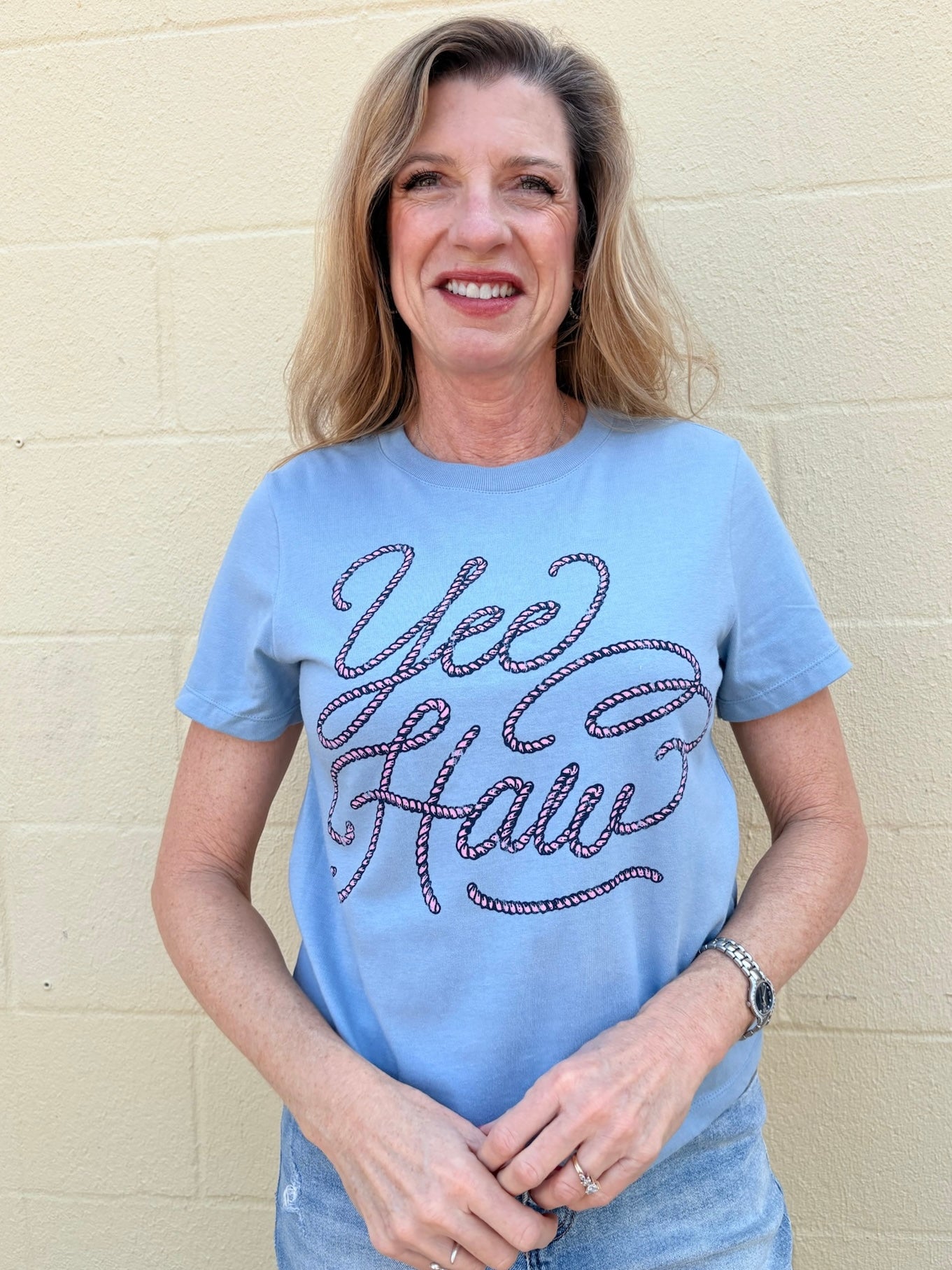 Yeehaw crop tee, western graphic top, mid-length crop shirt, pink rope graphic, southern chic apparel, cowgirl style, soft graphic tee, women's western fashion.
at ooh la la! in Grapevine TX 76051