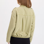 Back view of XCVI Tace Tencel Twill Relaxed Bomber Jacket in Artichoke Pigment green
