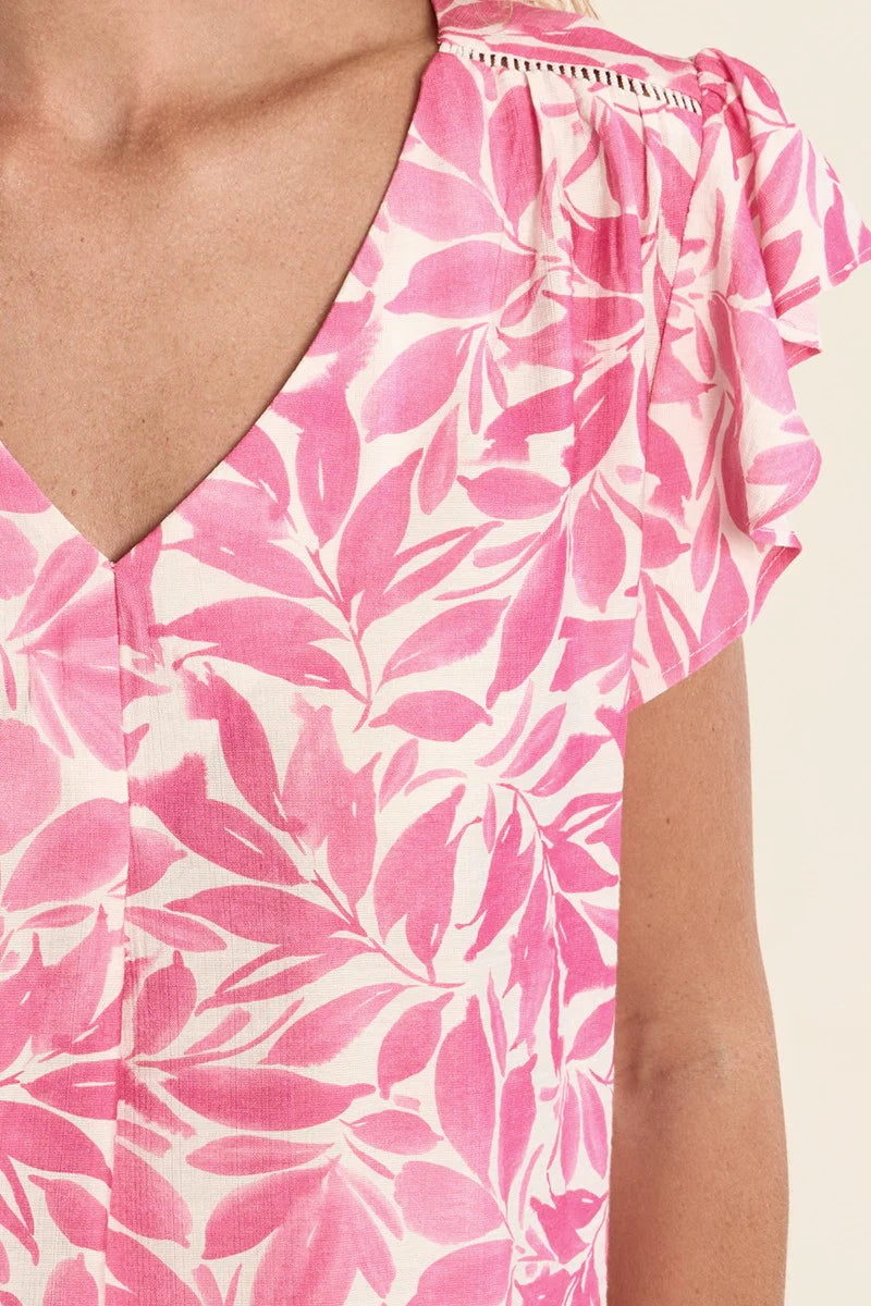 Flutter sleeve top, floral V-neck blouse, lightweight summer top, ruffled sleeve shirt, women’s botanical print top, pink floral blouse, breezy spring fashion. at ooh la la! in Grapevine TX 76051