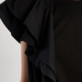 Black Asymmetrical top, ruffle crop top, sporty chic shirt, women's statement top, oversized cropped tee, streetwear fashion, architectural ruffle blouse.
at ooh la la! in Grapevine TX 76051