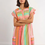 Boho beach dress, neon summer dress, flutter sleeve mini, geometric print dress, tassel trim dress, resort wear for women, cotton v-neck dress, vacation outfits, colorful sun dress. at ooh la la! in Grapevine TX 76051