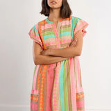 Boho beach dress, neon summer dress, flutter sleeve mini, geometric print dress, tassel trim dress, resort wear for women, cotton v-neck dress, vacation outfits, colorful sun dress. at ooh la la! in Grapevine TX 76051