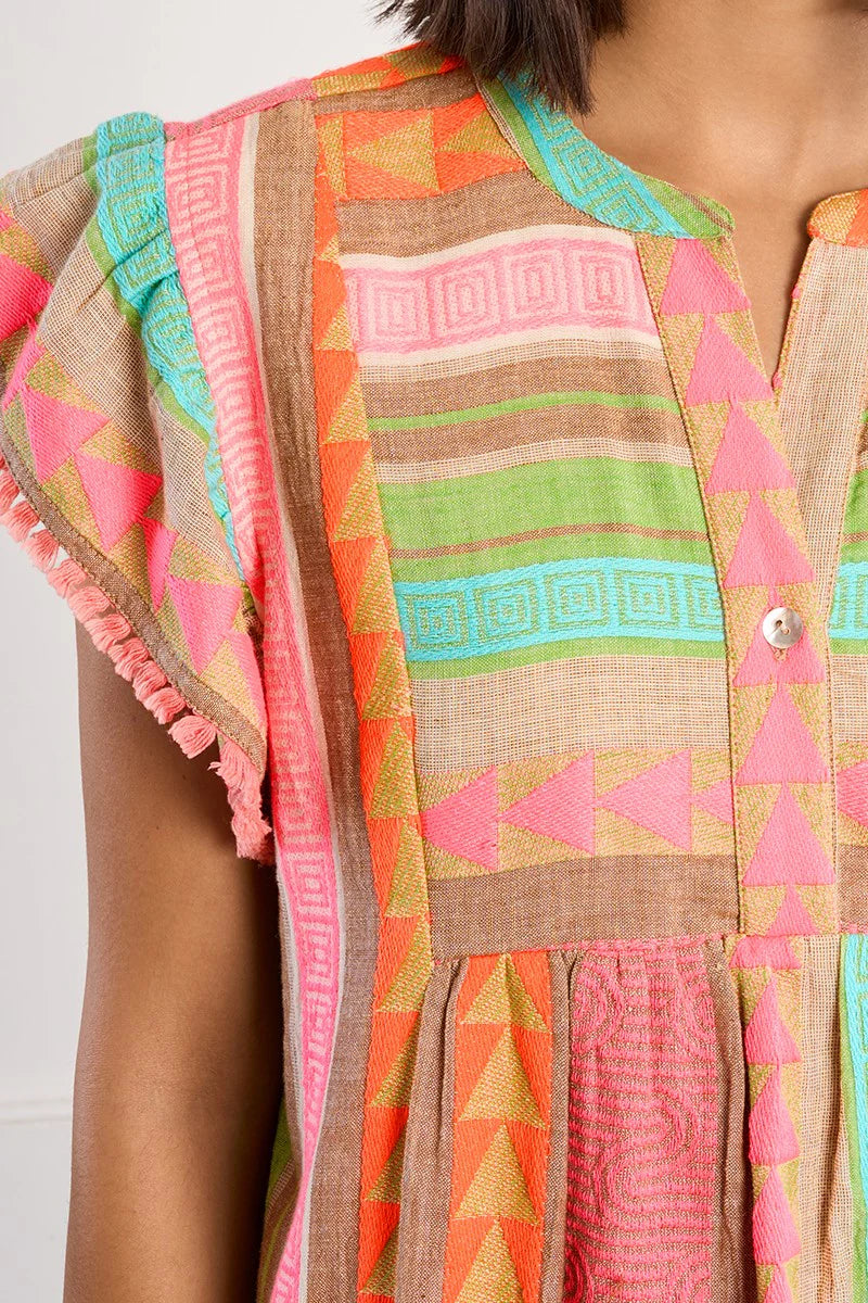 Boho beach dress, neon summer dress, flutter sleeve mini, geometric print dress, tassel trim dress, resort wear for women, cotton v-neck dress, vacation outfits, colorful sun dress. at ooh la la! in Grapevine TX 76051