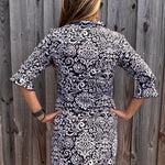 SPF 50 dress, polo dress for women, 3/4 sleeve flounce dress, sun protection clothing, summer golf dress, classy sporty dress, black and white paisley dress, gold button accents. at ooh la la! in Grapevine TX 76051