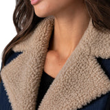 Close-up of Liverpool sherpa trimmed notch collar denim jacket in rinse wash on model