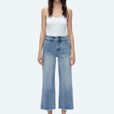 Model wearing high-rise wide-leg cropped jeans in light blue denim wash