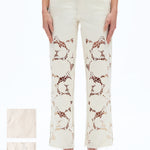 off white floral cutout jeans, embroidered straight leg pants, women's cream denim, high rise relaxed jeans, boho lace pants, luxury embroidered denim, off white floral trousers at ooh la la in Grapevine TX 76051