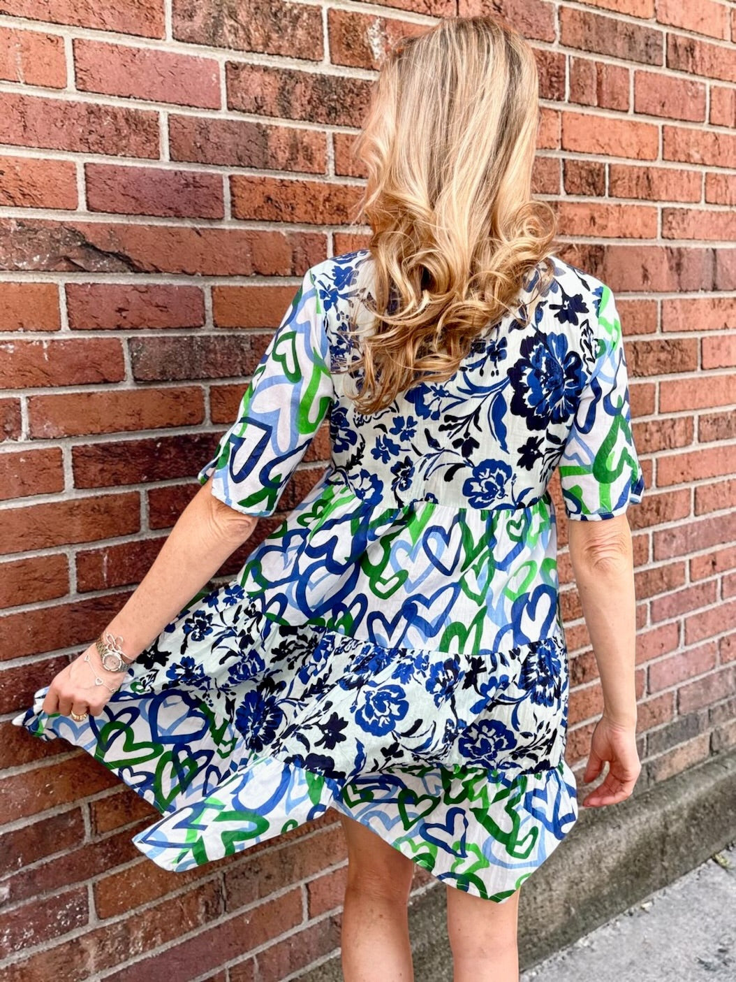 Organic cotton dress, floral shirt dress, tiered summer dress, Dress Addict, crinkle cotton dress, sustainable fashion, mixed floral and hearts print, summer dresses with pockets. at ooh la la in Grapevine TX 76051