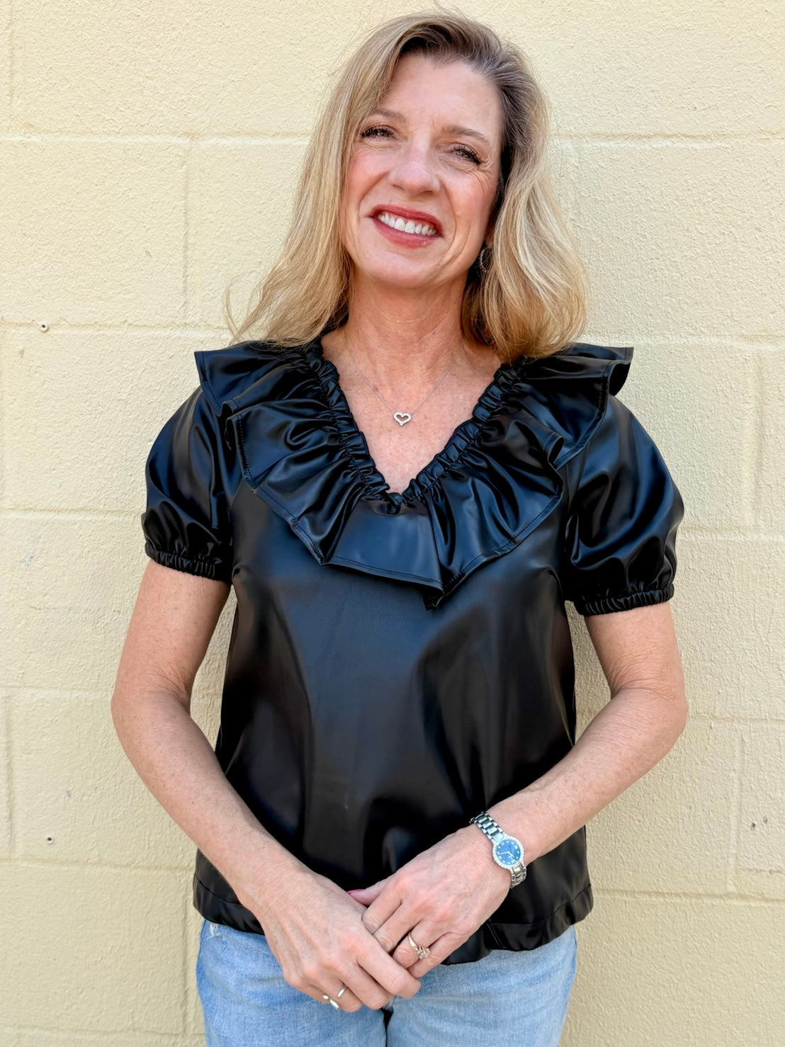 Ruffle V Neck Faux Leather Top in black at ooh la la in Grapevine TX 76051