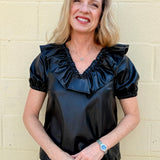 Ruffle V Neck Faux Leather Top in black at ooh la la in Grapevine TX 76051