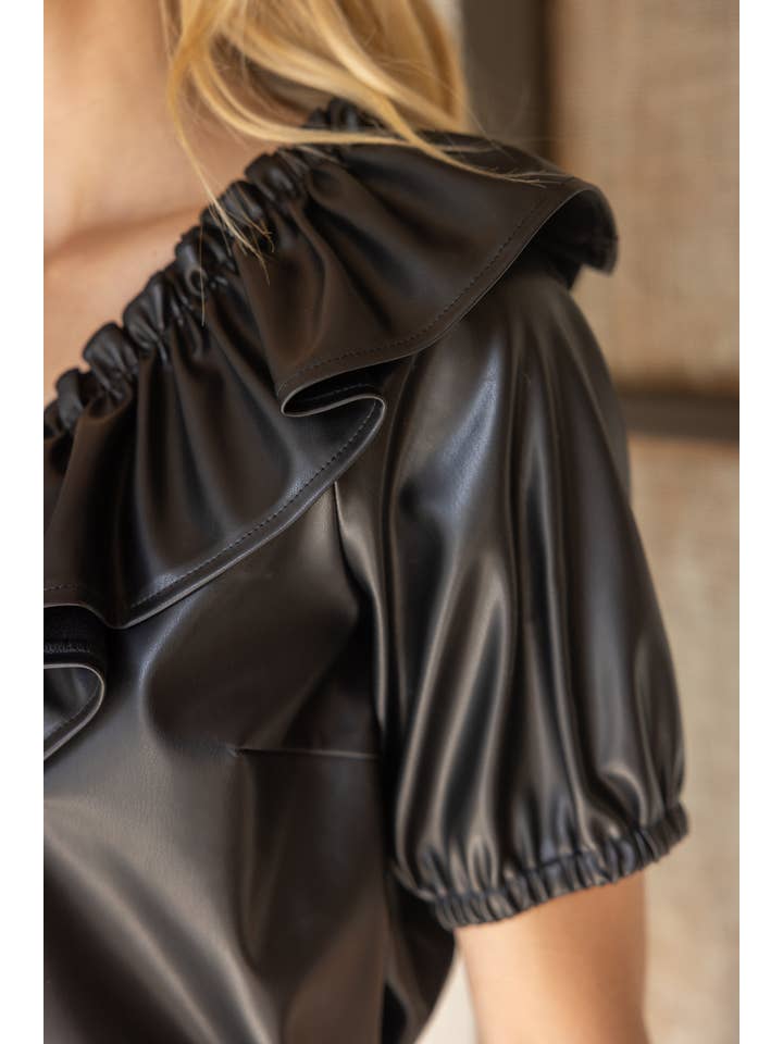 Ruffle V Neck Faux Leather Top in black at ooh la la in Grapevine TX 76051