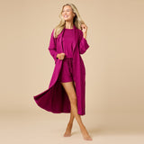 Woman wearing Softies Dream Shawl Collar Robe in magenta at ooh la la! in Grapevine TX 76051