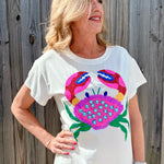Queen of Sparkles, Sequin Crab Tee, Rainbow Sequin Shirt, Coastal Chic Apparel, Luxury Graphic Tee, Rhinestone Crab Top, Beach Vacation Outfit, Designer White Tee, Summer Sparkle Fashion. at ooh la la! in Grapevine TX 76051