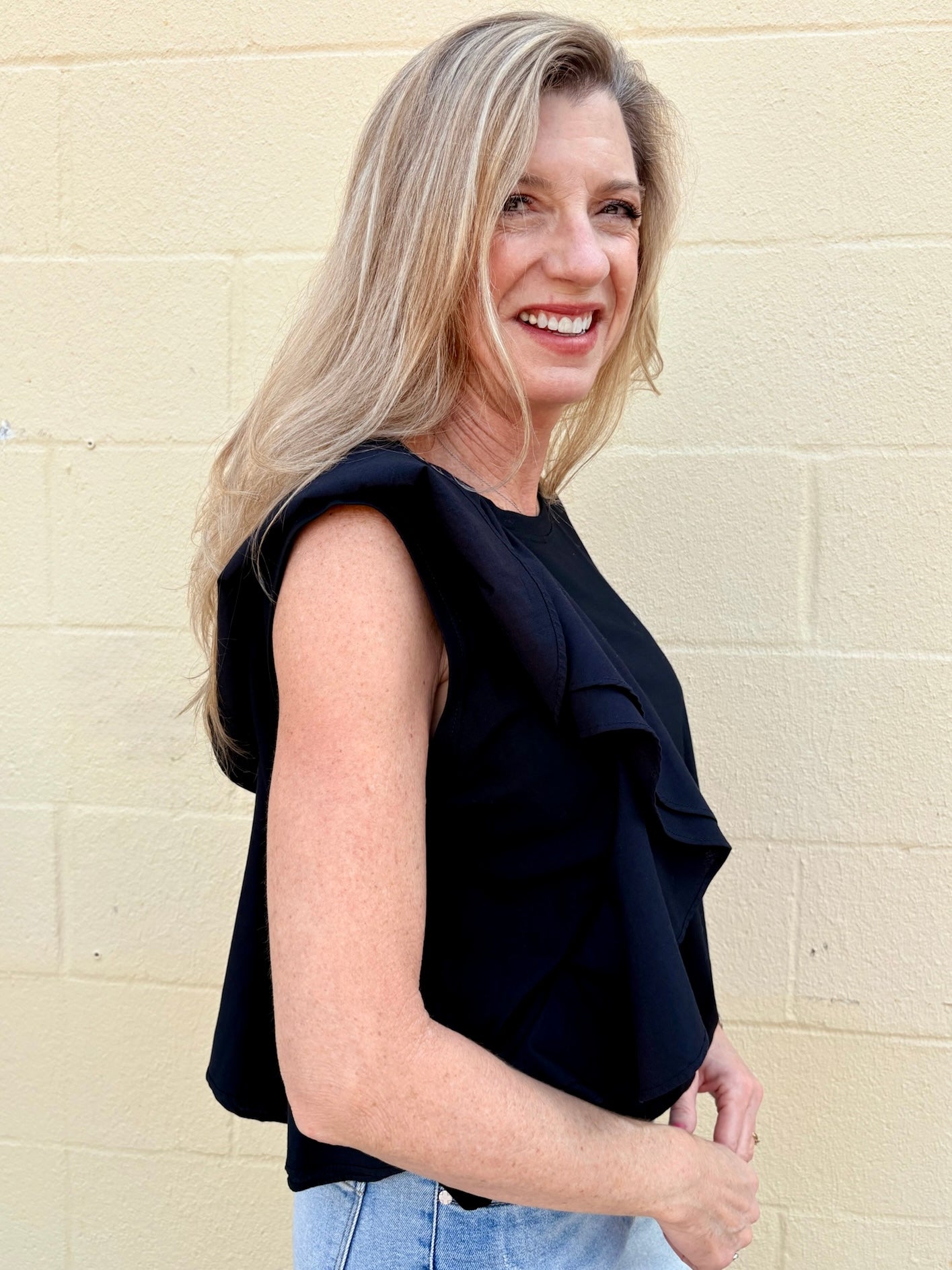Black Asymmetrical top, ruffle crop top, sporty chic shirt, women's statement top, oversized cropped tee, streetwear fashion, architectural ruffle blouse.
at ooh la la! in Grapevine TX 76051