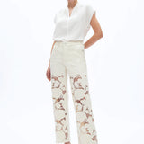 off white floral cutout jeans, embroidered straight leg pants, women's cream denim, high rise relaxed jeans, boho lace pants, luxury embroidered denim, off white floral trousers at ooh la la in Grapevine TX 76051