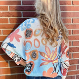 Abstract Pink & Blue Batwing Sweater at ooh la la! in Grapevine TX 76051