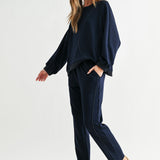 Navy Kaelynn Pant, Joh, luxury straight leg pants, matte crepe knit trousers, minimalist women's loungewear, designer elastic waist pants, premium stretch crepe pants, high-end coordinated sets at ooh la la! in Grapevine TX 76051
