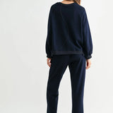 Navy Kaely Top, Joh Brand, luxury long sleeve top, matte stretch crepe knit, minimalist designer top, tonal stitch detail, premium women's knitwear, high-end loungewear, elegant relaxed fit top at ooh la la! in Grapevine TX 76051
