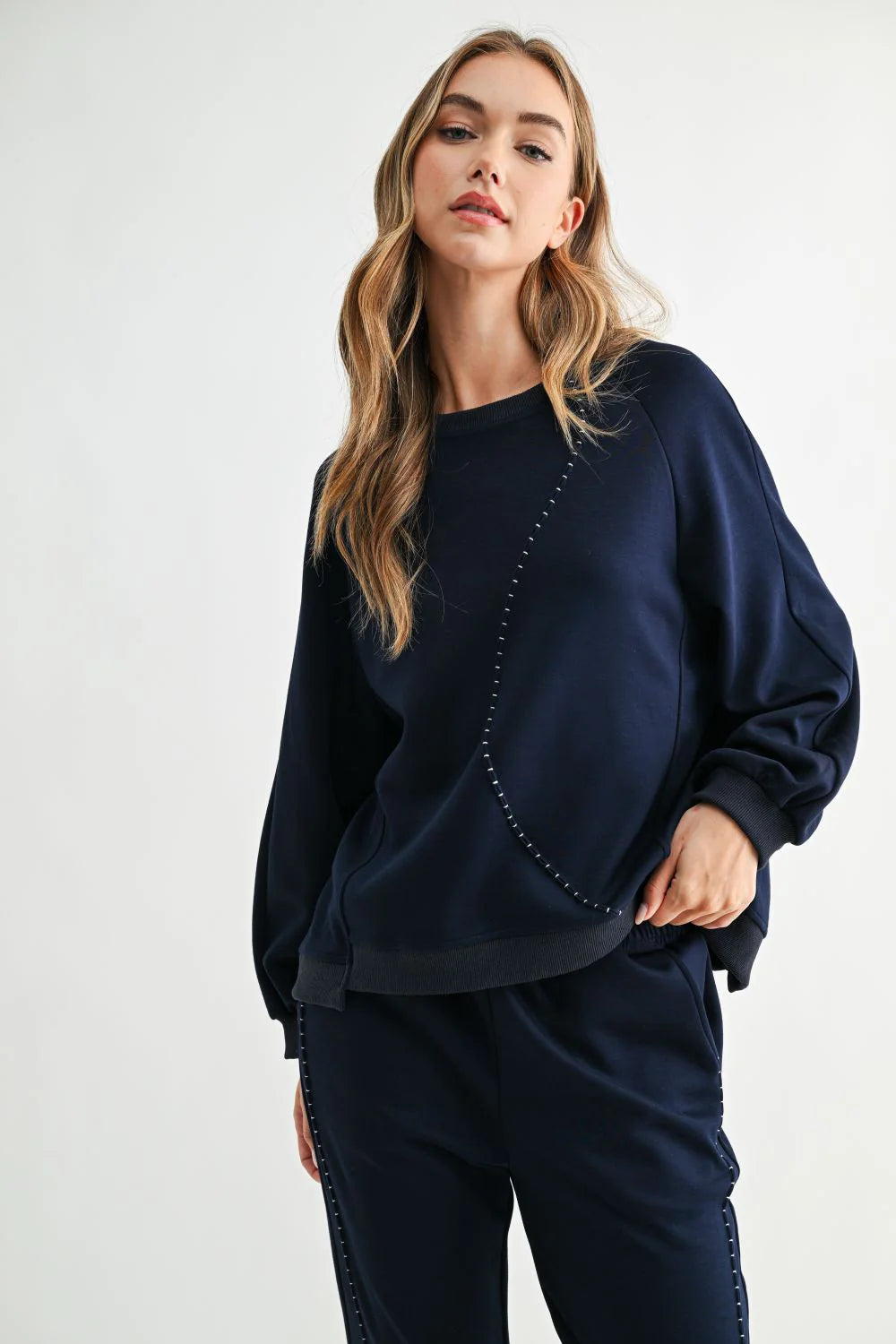 Navy Kaely Top, Joh Brand, luxury long sleeve top, matte stretch crepe knit, minimalist designer top, tonal stitch detail, premium women's knitwear, high-end loungewear, elegant relaxed fit top at ooh la la! in Grapevine TX 76051