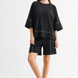 Black Carlay Top, Joh, luxury top, minimalist fashion, contrast stitch blouse, high-end short sleeve, designer relaxed fit, quiet luxury clothing, premium women's tops at ooh la la in Grapevine TX 76051