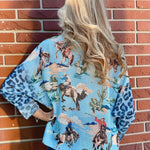 Giddy Up! Western Cowboys and Leopard Batwing Sweater in blue at ooh la la! in Grapevine TX 76051
