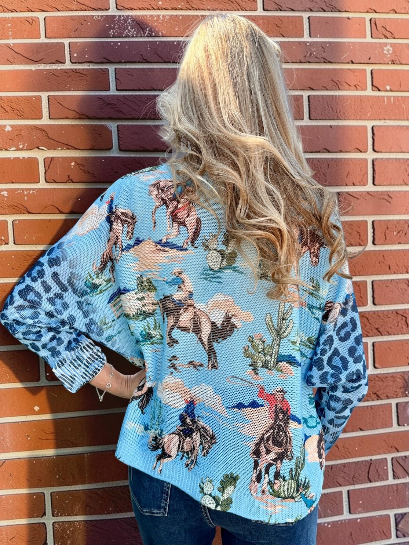 Giddy Up! Western Cowboys and Leopard Batwing Sweater in blue at ooh la la! in Grapevine TX 76051