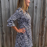 SPF 50 dress, polo dress for women, 3/4 sleeve flounce dress, sun protection clothing, summer golf dress, classy sporty dress, black and white paisley dress, gold button accents. at ooh la la! in Grapevine TX 76051