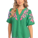 embroidered linen top, bubble sleeve blouse, green floral top, resort wear for women, v-neck summer blouse, pink and green top, botanical embroidery clothing, puff sleeve linen shirt at ooh la la! in Grapevine TX 76051