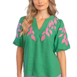 embroidered linen top, bubble sleeve blouse, green floral top, resort wear for women, v-neck summer blouse, pink and green top, botanical embroidery clothing, puff sleeve linen shirt at ooh la la! in Grapevine TX 76051
