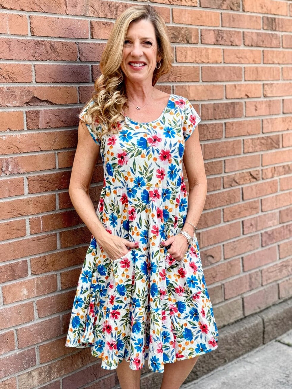 Dress Addict Jade dress, organic cotton floral dress, daisy print scoop neck, bias cut cotton dress, crinkle cotton summer dress, sustainable floral fashion, tiered skirt knee length dress at ooh la la! in Grapevine TX 76051
