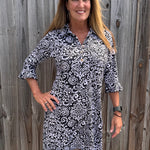 SPF 50 dress, polo dress for women, 3/4 sleeve flounce dress, sun protection clothing, summer golf dress, classy sporty dress, black and white paisley dress, gold button accents. at ooh la la! in Grapevine TX 76051