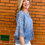 Blue Lace blouse, cotton boho top, bell sleeve shirt, floral embroidery top, scalloped hem blouse, feminine V-neck top, tiered lace top, bohemian fashion, white lace blouse, black vintage style top. at ooh la la! in Grapevine TX 76051