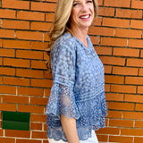 Blue Lace blouse, cotton boho top, bell sleeve shirt, floral embroidery top, scalloped hem blouse, feminine V-neck top, tiered lace top, bohemian fashion, white lace blouse, black vintage style top. at ooh la la! in Grapevine TX 76051