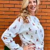 Holiday Dogs on Repeat Sweatshirt at ooh la la! In Grapevine TX 76051