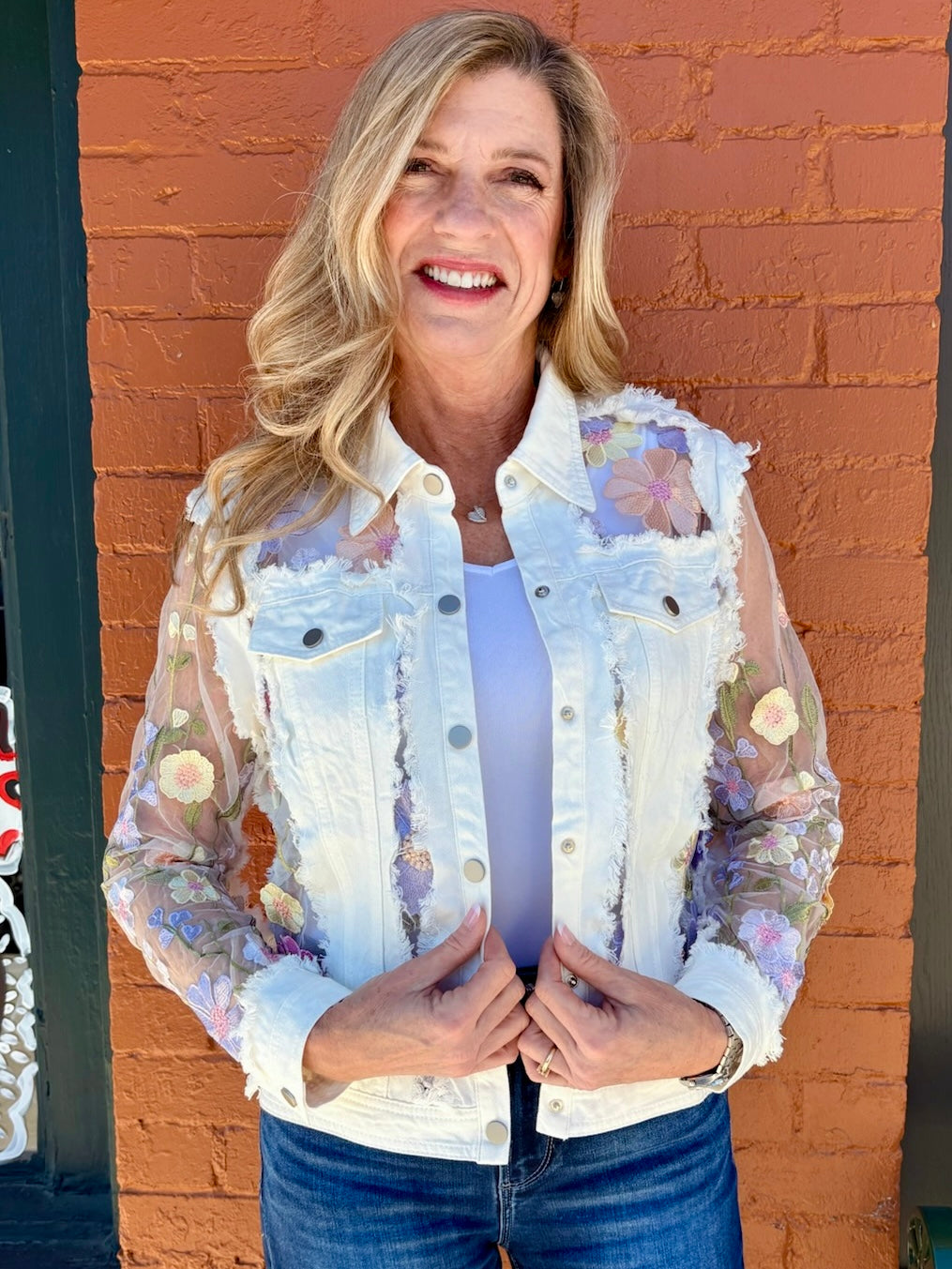 Denim Jacket with Floral Appliqué on Mesh in white at ooh la la! in Grapevine TX 76051