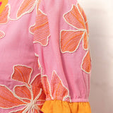Embroidered floral dress, pink shift dress, summer vacation outfit, boutique floral dress, oversized embroidery, puff sleeve summer dress, resort wear for women, designer style shift dress. at ooh la la! in Grapevine TX 76051
