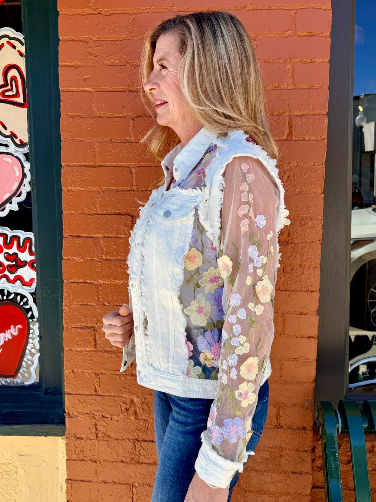 Denim Jacket with Floral Appliqué on Mesh in white at ooh la la! in Grapevine TX 76051
