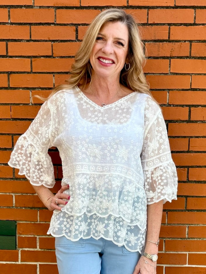 White Lace blouse, cotton boho top, bell sleeve shirt, floral embroidery top, scalloped hem blouse, feminine V-neck top, tiered lace top, bohemian fashion, white lace blouse, black vintage style top. at ooh la la! in Grapevine TX 76051