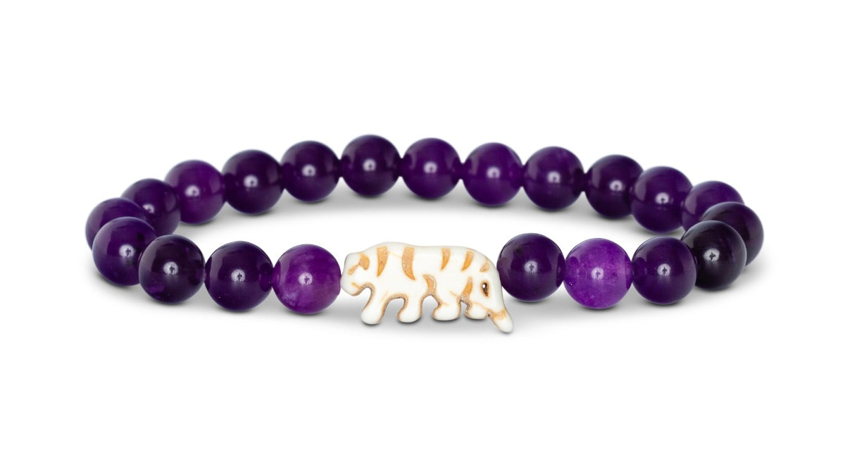 Fahlo Prowl Bracelet with royal deep purple beads and white tiger charm centerpiece