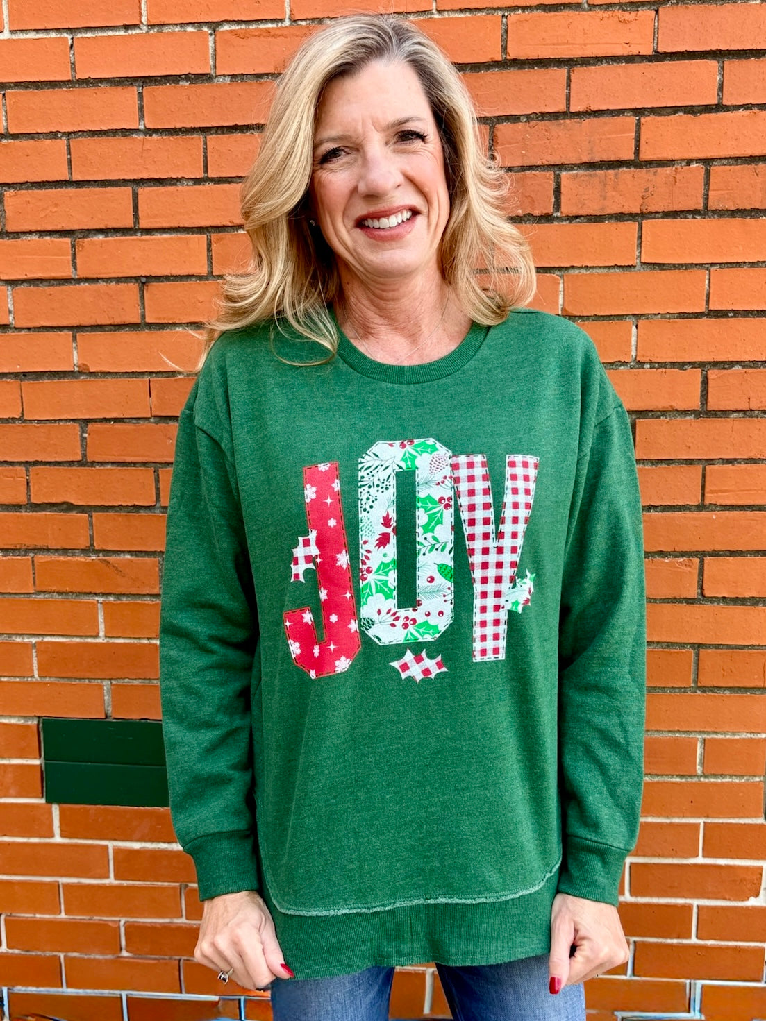 Christmas Joy Quilted Applique Rounded Bottom Sweatshirt in green at ooh la la! in Grapevine TX 76051