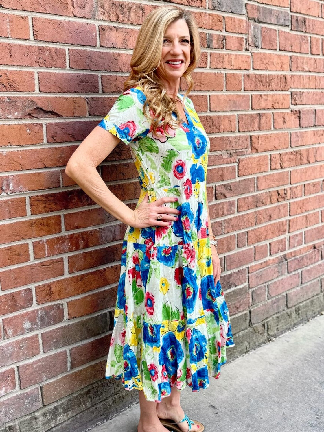 Dress Addict Jazy, organic cotton midi dress, multi color floral dress with pockets, sustainable summer dress, bias cut v-neck dress, women's tiered floral midi, travel-friendly crinkle dress. at ooh la la! in Grapevine TX 76051