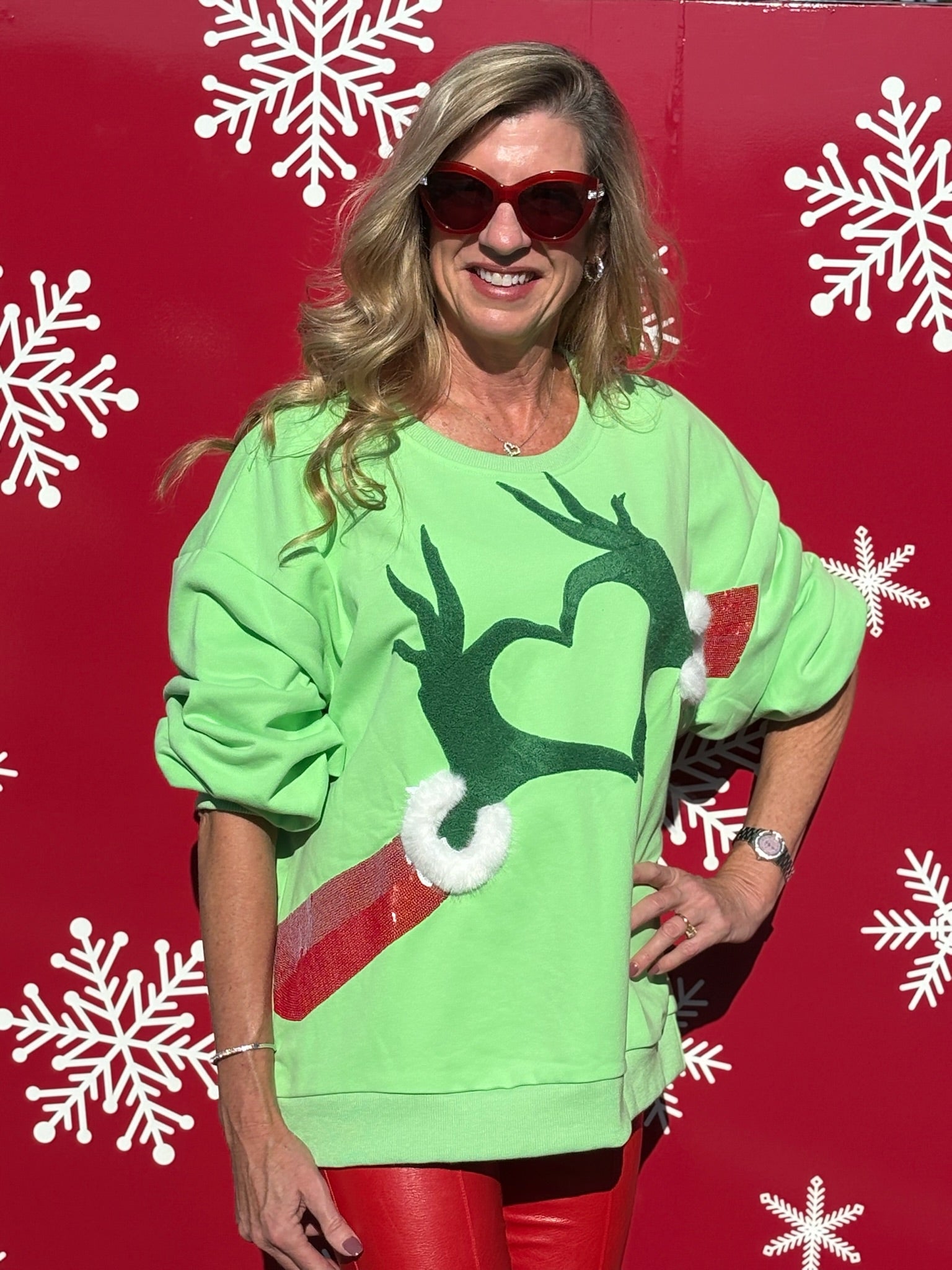 Queen of Sparkles Green Grinch Heart Hands Sweatshirt at ooh la la! in Grapevine TX 76051