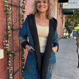 Reversible Hooded Rain Coat In blue blocks/black at ooh la la! in Grapevine TX 76051