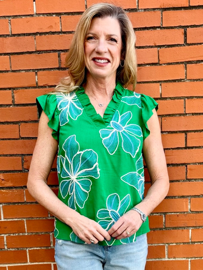 Floral embroidered top, green ruffle blouse, V-neck summer top, women's boho clothing, embroidered floral shirt, ruffle sleeve top, woven summer blouse.
ooh la la! in Grapevine TX 76051