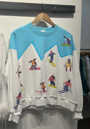 Queen of Sparkles White/Blue Skiers on Mountain Sweatshirt at ooh la la! in Grapevine TX 76051