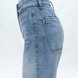 Light blue high-rise wide-leg cropped jeans on model against white background