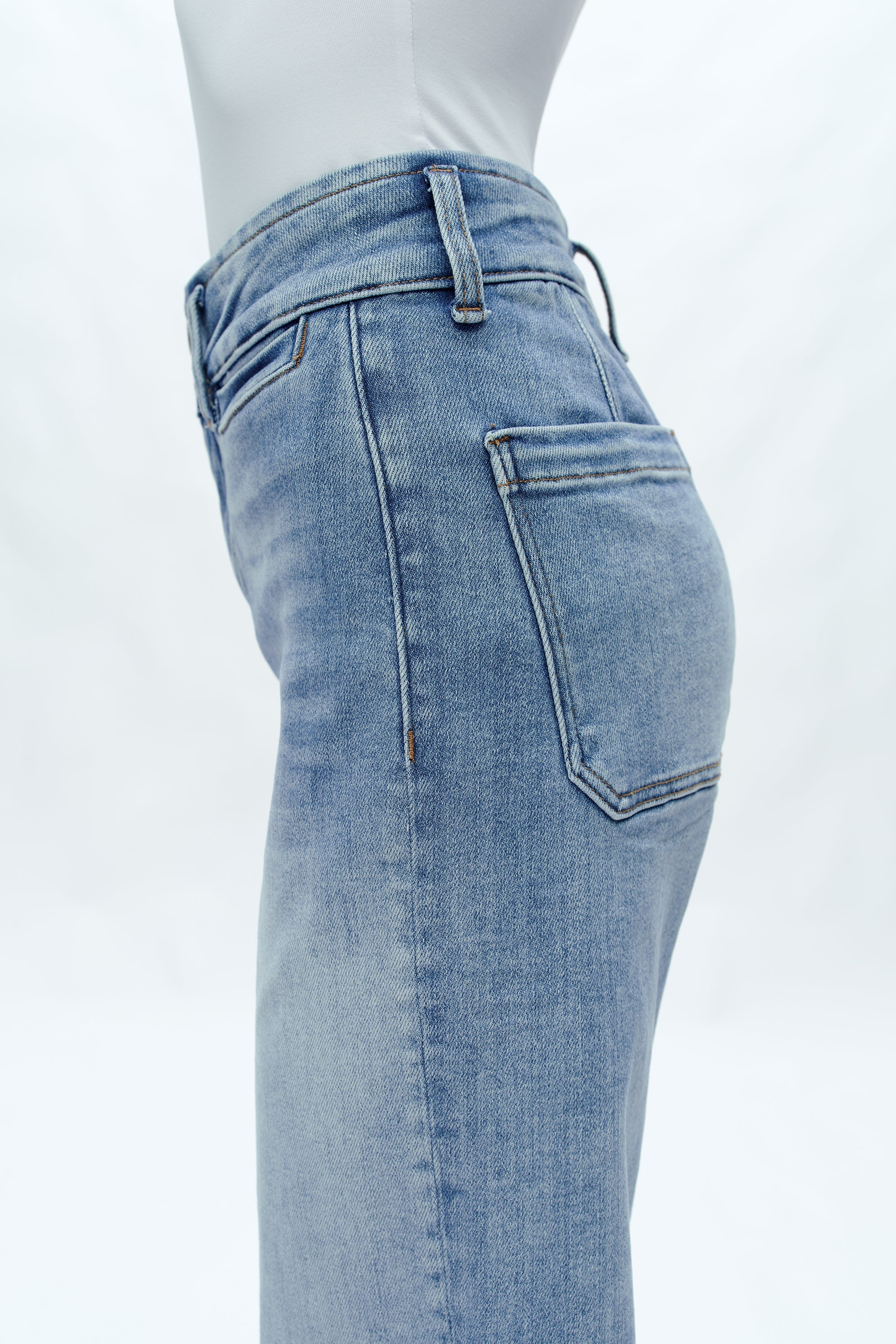 Light blue high-rise wide-leg cropped jeans on model against white background