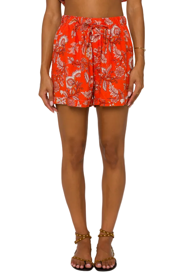 Orange floral shorts with drawstring waist on model against white background