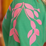 embroidered linen top, bubble sleeve blouse, green floral top, resort wear for women, v-neck summer blouse, pink and green top, botanical embroidery clothing, puff sleeve linen shirt at ooh la la! in Grapevine TX 76051