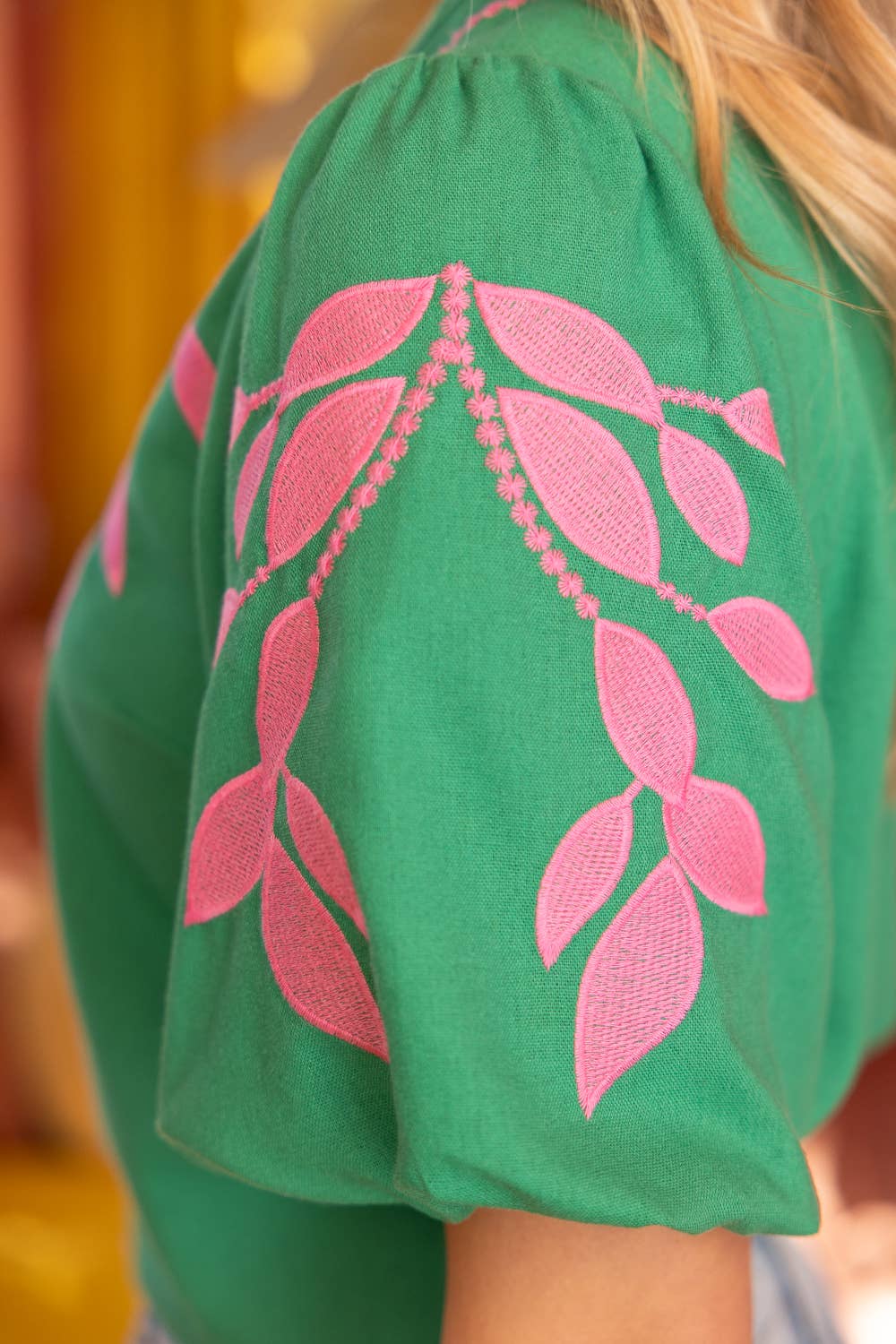 embroidered linen top, bubble sleeve blouse, green floral top, resort wear for women, v-neck summer blouse, pink and green top, botanical embroidery clothing, puff sleeve linen shirt at ooh la la! in Grapevine TX 76051